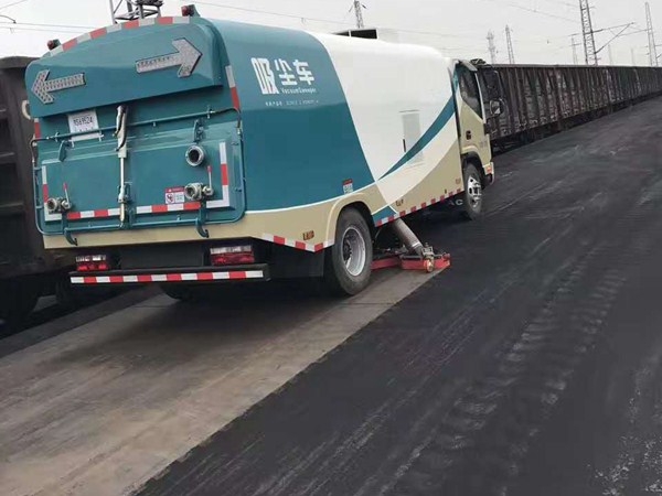 How a vacuum cleaner vehicle work with backflushing after unloading?